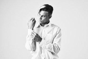 young man buttoning up his shirt