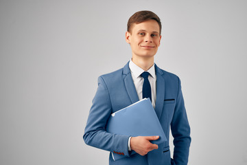 successful business man smiling on a light background