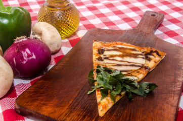 handmade pear pizza prepared on a clay furnace pizza