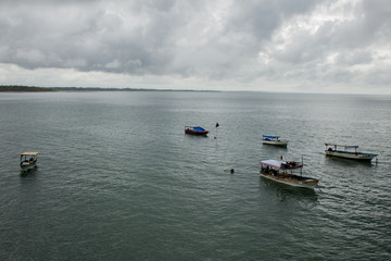 Five boats anchored in the bay in winter