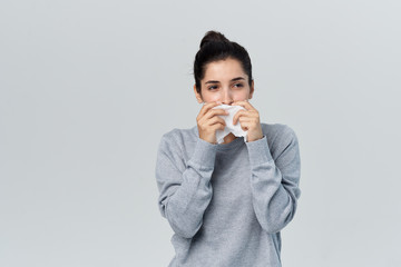 woman has flu runny nose