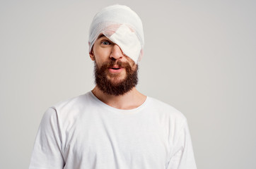bandage on head bruised man