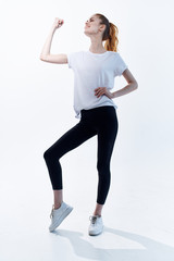 young woman doing fitness exercise isolated on white