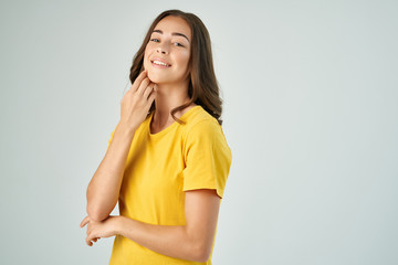 woman in a yellow T-shirt logo