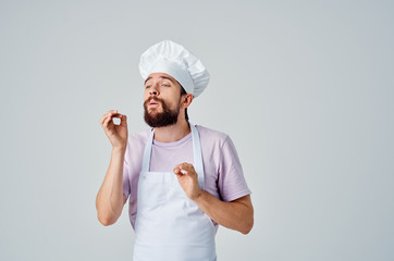 the Italian chef in the headgear gestures with his hands