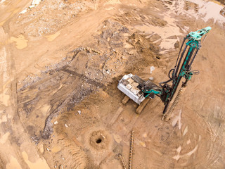building site in stage of preparation of the ground with a drilling rig. aerial view