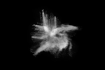 Launched white powder, isolated on black background.