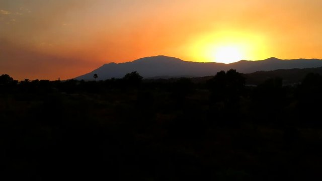 Summer evening sunset in Southern Spain, beautiful landscape images of the sun going down over the mountains in Southern Europe