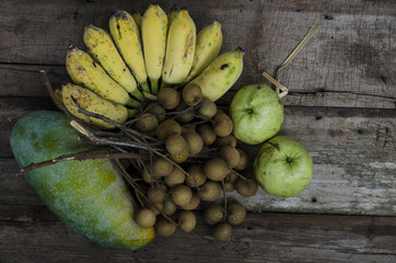 fruit on season on wood background Banana longan