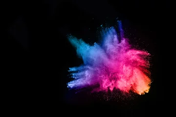 Zelfklevend Fotobehang abstract colored dust explosion on a black background.abstract powder splatted background,Freeze motion of color powder exploding/throwing color powder, multicolored glitter texture. © kitsana