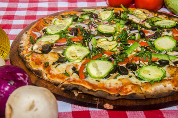 handmade vegetarian pizza prepared on a clay furnace pizza