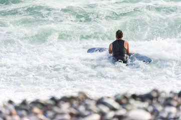 Naklejka premium Surfer enjoying the waves on the beach near the district of Miraflores.