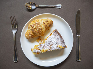 Breakfast: dish with home made cake and croissant