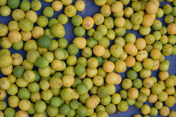 many lemons on a blue surface