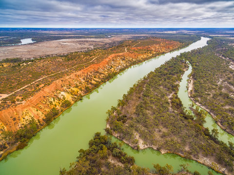 Beautiful eroding orange sandstone cliffs looming over the iconic Murray RIver