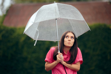 Woman Holding Transparent Umbrella in the Rain