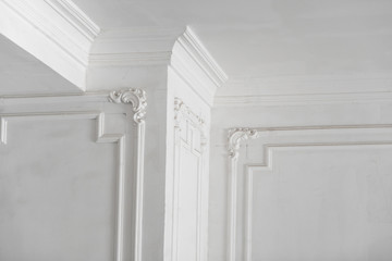 unfinished plaster molding on the ceiling and columns. decorative gypsum finish. plasterboard and...