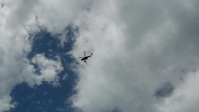 During the wildfires in Attica Greece. View of the smoke from the highway and Skycrane helicopter firefighting.