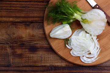 Fennel bulb on wooden cutting board healthy vegetable for salad