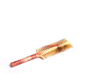 Hairbrush with hair isolated on white background