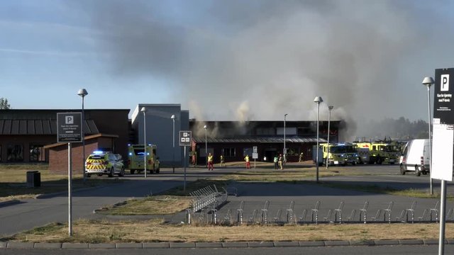 4k Footage of fire at school in very sunny and warm day in Norway, Akershus, Lillestrom.
Fireman department and police is trying to take out the fire.
