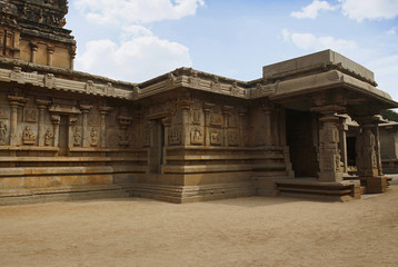 Fototapeta premium Side, south, porch of the ardhamandapa and the outer wall of the main shrine, Hazara Rama Temple. Royal Center or Royal Enclosure. Hampi, Karnataka. South west view.