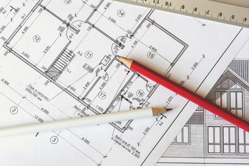 The architectural plan of the house is printed on a white sheet of paper. A red and  white pencil on it. June 2018, Russia, Moscow