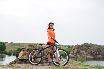 Obraz premium Active lifestyle, young woman on a bike ride.