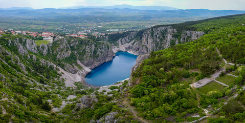 Obraz na płótnie Canvas Blue Lake (Croatian: Modro jezero or Plavo jezero) is a karst lake located near Imotski in Croatia. It lies in a deep sinkhole possibly formed by the collapse of an enormous cave.