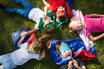 Group kids friends  Superhero playing togetherness and having fun outdoor..
