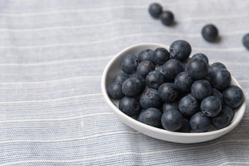 Blueberry fruits in white bowl