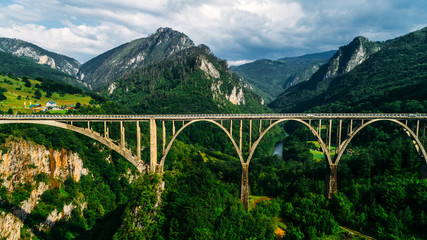 Aerial View of Durdevica Tara Arc Bridge in the Mountains, One of the Highest Automobile Bridges in Europe.
