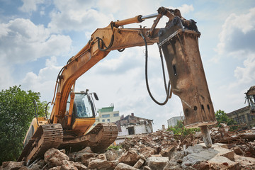 secondary demolition by excavator with hydraulic hydrohammer breaker