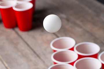 Game Beer Pong on wooden table