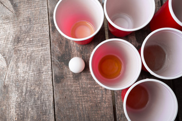 Game Beer Pong on wooden table