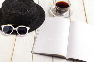 Mock-up magazine or catalog on a wooden table.