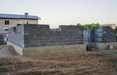 Fototapeta na wymiar Concrete foundation of a new house, wall construction