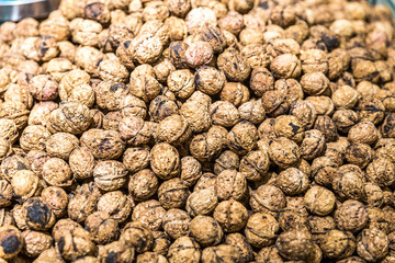 Walnuts background. Walnuts texture. Group walnuts on wooden background. Healthy organic food concept. Top view. View above
