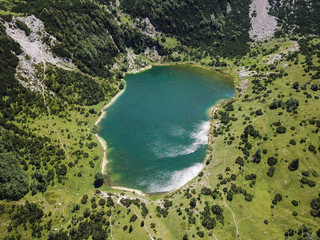 Obraz premium Šator Mountain (Šator planina) is in the Dinaric Alps, Bosnia and Herzegovina. Just below the peak, the Šator Lake (Šatorsko jezero) is positioned.
