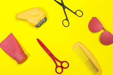 Flat lay composition with professional hairdresser tools on color background
