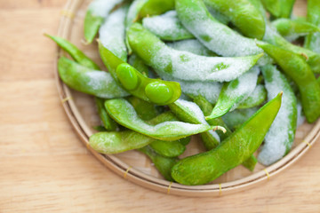 studio shot of Japanese style boiled beans EDAMAME on basket..