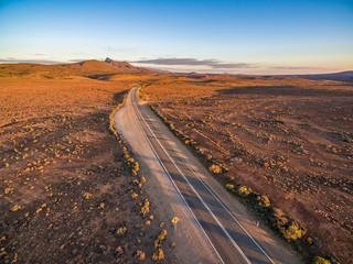 Fototapeta na wymiar Beautiful sunset over rural highway passing through South Australian desert