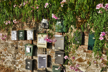mailboxes on the old stone wall