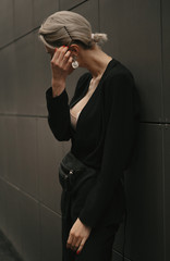 Beautiful stylish and fashionable girl in stylish clothes on the street