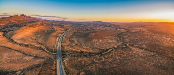 The Outback Highway passing through Flinders Ranges at dusk - aerial panorama © Greg Brave