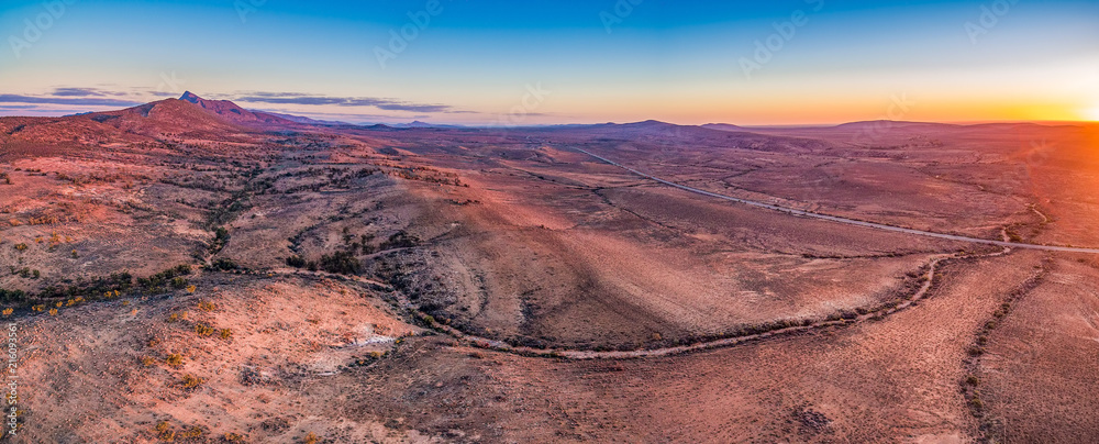 Wall mural aerial panoramic landscape of sunset sun flare over alien landscape of flinders ranges in south aust