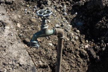 old water faucet in garden