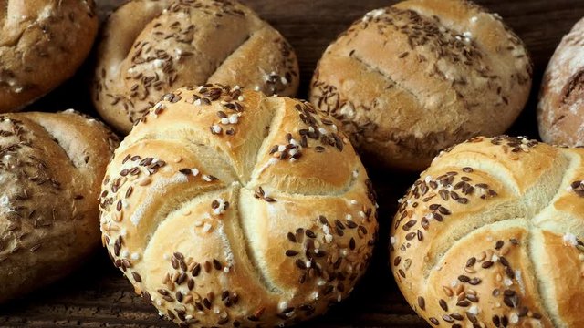 Different bread on a rustic wooden background. Bakery assortment of bread.