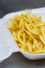 french fried potatoes on white box
