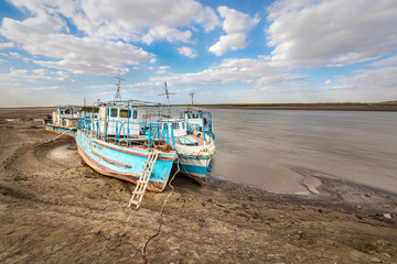 Old ships on the shore of a drying Amu Darya river, Xorazm Region, Uzbekistan